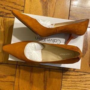Burnt Orange pumps Size 10. Never worn
